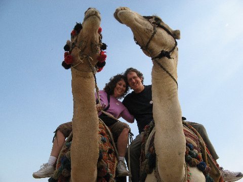 Gail and Dave on a  camel  in the Sahara  Desert